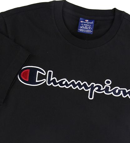 T-Shirt Champion Fashion - Noir av. Logo T-Shirt Champion Fashion - Noir av. Logo