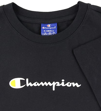T-Shirt Champion Fashion - Noir av. Logo T-Shirt Champion Fashion - Noir av. Logo